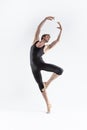 Professional Ballet Dancer Young Man in Black Dance Suit Posing in Ballanced Dance Pose Studio On White