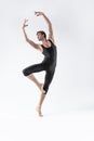 Professional Ballet Dancer Young Man in Black Dance Suit Posing in Ballanced Dance Pose Studio On White