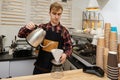 Professional barista man making coffee at the coffee shop. Royalty Free Stock Photo