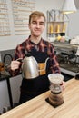 Professional barista man making coffee using filter Royalty Free Stock Photo