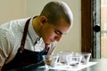 Professional barista testing the smell of a new coffee.