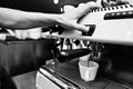 Professional barman at coffee machine making espresso in a cafe Royalty Free Stock Photo