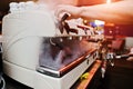 Professional barman at coffee machine with vapor making espresso Royalty Free Stock Photo