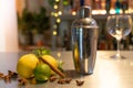 Professional bartender cocktail shaker, bar counter with lemons, limes and species with copy space for text. Royalty Free Stock Photo