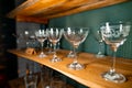 Professional bartender equipment as different transparent white ornate glasses