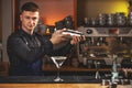 Professional bartender mixing a cocktail