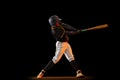 Professional baseball player, pitcher in sports uniform and equipment playing baseball isolated on black studio