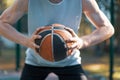 Professional basketball player holding ball, aiming before throwing, close-up advertising sportive photo Royalty Free Stock Photo