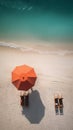 Professional Beach Photography: Two Loungers And An Umbrella On White Sand Near Sea Water