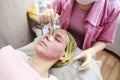 Professional - beautician puts on the skin for the chemical peel