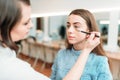 Professional beautician work with woman eyebrows Royalty Free Stock Photo