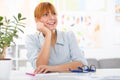 Professional beautiful young woman sitting her desk at her home Royalty Free Stock Photo