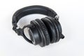 Professional black wired headphones Audio-Technica with gold plug on white background Royalty Free Stock Photo