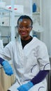 Professional black woman scientist looking at camera smiling