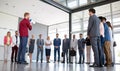 Professional boss standing in front of his business team and talk on megaphone Royalty Free Stock Photo