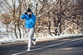 Professional boxer and athlete working out outdoor on snow and cold