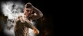 Professional boxer posing in the studio. He stands in front of the camera and elbows. The concept of sport, boxing, healthy