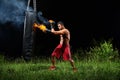 Professional boxer punching sandbag outdoors with his boxing glo