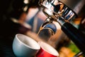 Professional brewing - coffee bar details. Espresso details coffee pouring from espresso machine. Barista details in cafe shop Royalty Free Stock Photo