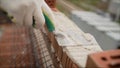 Professional bricklaying during the construction of a house. The construction of walls made of expensive red bricks