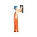 Professional Builder Installing Ceramic Tiles on Wall, Male Construction Worker Character in Orange Overalls and Blue Royalty Free Stock Photo