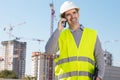 Professional builder standing talking on a phone