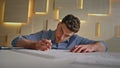 Professional builder writing draft in modern architectural agency close up. Royalty Free Stock Photo