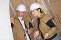 professional builders man and woman looking at something