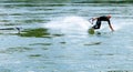 Professional bungee surfer Sebastian Dessecker bungee surfing on the Rhine near Bad Saeckingen