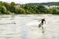 Professional bungee surfer Sebastian Dessecker bungee surfing on the Rhine near Bad Saeckingen