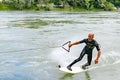 Professional bungee surfer Sebastian Dessecker bungee surfing on the Rhine near Bad Saeckingen