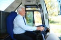 Professional bus driver at steering wheel Royalty Free Stock Photo