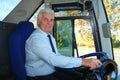 Professional bus driver at steering wheel Royalty Free Stock Photo