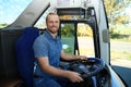 Professional bus driver at steering wheel Royalty Free Stock Photo
