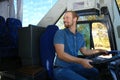 Professional bus driver at steering wheel Royalty Free Stock Photo