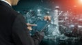 Professional Businessman Analyzing Data on Digital Tablet with Futuristic Graphs and Cityscape Background in Modern Royalty Free Stock Photo