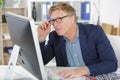 professional businessman in formal suit reading information on pc screen