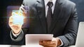 Professional businessman interacts with a glowing digital document icon using a tablet, illustrating paperless office solutions, Royalty Free Stock Photo