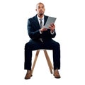 The professional businessman needs his technological tools. Studio shot of a handsome young businessman using a tablet