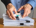 Businessman Sorting Documents and Files on Desk Royalty Free Stock Photo