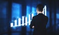 Businessman Analyzing Growth Trends on Digital Screen with Graphs and Charts in Modern Office Environment Impute Royalty Free Stock Photo