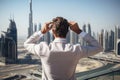 Overwhelmed Man Contemplating Urban Skyline from High-Rise Building. Generative Ai