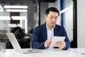 Professional businessman using tablet in modern office Royalty Free Stock Photo