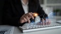 Professional Businessperson Analyzing Financial Data with Digital Graphs on Computer Keyboard in Modern Office Royalty Free Stock Photo