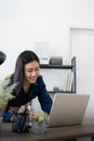 Professional businesswoman working at her home via laptop, young female manager using computer laptop while sitting on Royalty Free Stock Photo