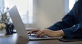 Professional businesswoman working at her home via laptop, young female manager using computer laptop while sitting on Royalty Free Stock Photo