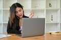 Professional and busy young Asian businesswoman on the phone call with her business client Royalty Free Stock Photo