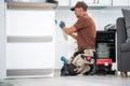 Professional Cabinetmaker Finishing New Kitchen Cabinets Royalty Free Stock Photo