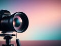 Professional camera with big lens on tripod with gradient background Royalty Free Stock Photo