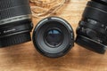 Professional camera lenses on the rustic wooden background. Flat lay. Mockup for photo or videomaker advertisement Royalty Free Stock Photo